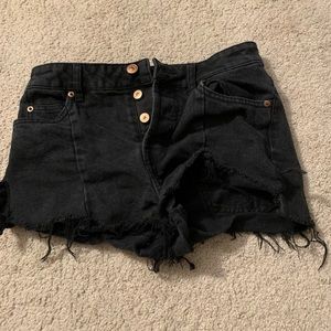 Black distressed shorts.